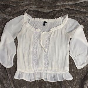 White ruffle blouse with sequin